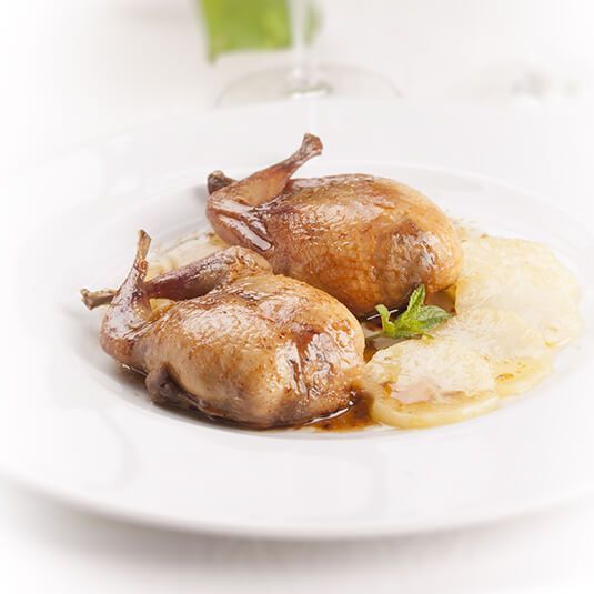 Roasted whole quail with potatoes